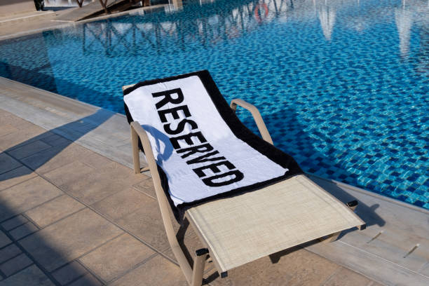 istock Reserved sun lounger by the pool 1176869659