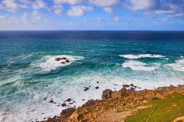 istock Cabo da Roca, Portugal. Lighthouse and cliffs over Atlantic Ocean, the most westerly point of the European mainland. 1176869883