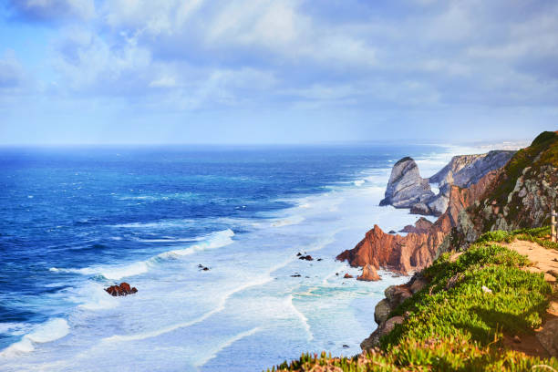 istock Cabo da Roca, Portugal. Lighthouse and cliffs over Atlantic Ocean, the most westerly point of the European mainland. 1176869884