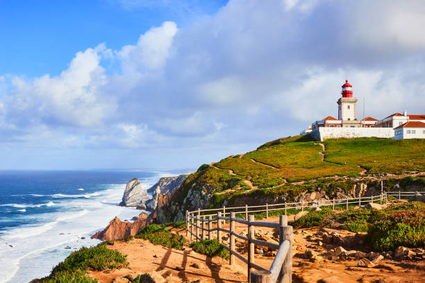 istock Cabo da Roca, Portugal. Lighthouse and cliffs over Atlantic Ocean, the most westerly point of the European mainland. 1176869991