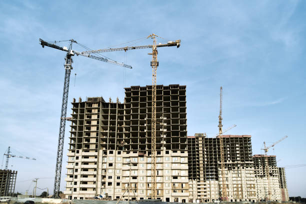 istock Construction site, silhouette crane and new house 1176870177