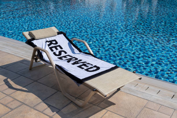 istock Reserved sun lounger by the pool 1176870910