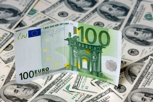 One hundred Euro on Dollar background