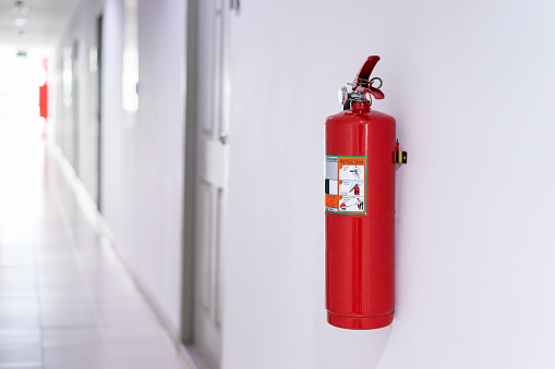 Fire extinguisher on wall in building