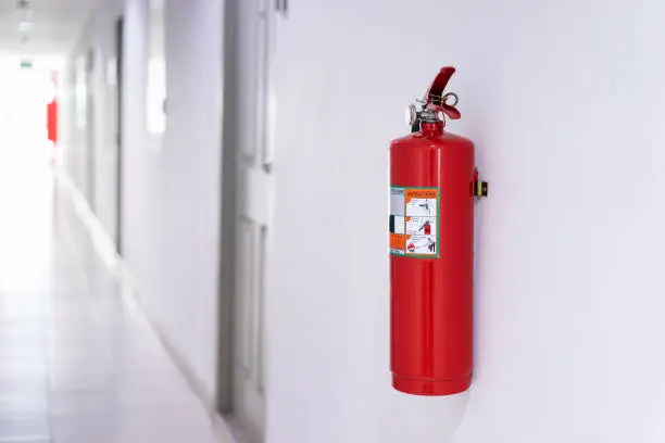 Photo of Fire extinguisher on wall in building