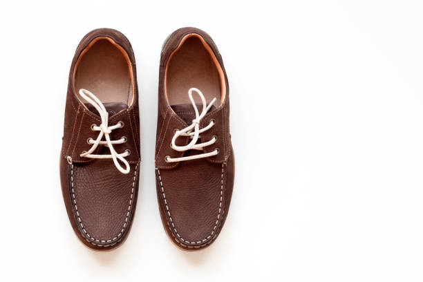 istock shoe over white background shopping concept 1176885609