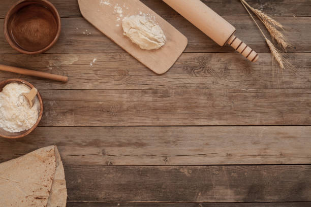istock flour and bread over wooden bakery table 1176885921