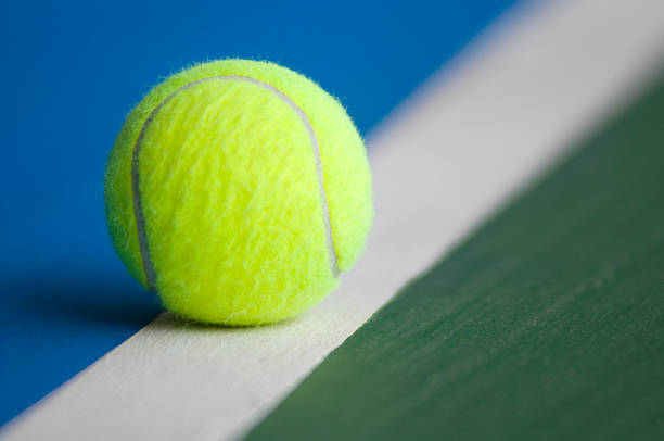 istock Tennis ball on the line 117688617
