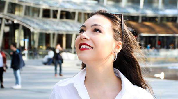 istock Woman walking in a modern city 1176890834