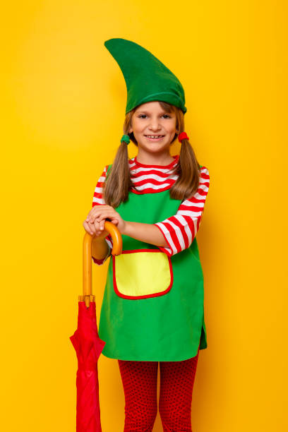 istock Christmas elf holding an umbrella 1176894623