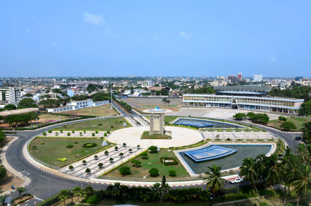 Lomé, Togo - Independence Square, the center of the country - Palais de Congrés on the top right and Independence monument in the center of the square Lomé, Togo: view over Independence Square (Place de l'Independance), the de facto center of the country - Palais de Congrés on the top right and Independence monument in the center of the square togo stock pictures, royalty-free photos & images