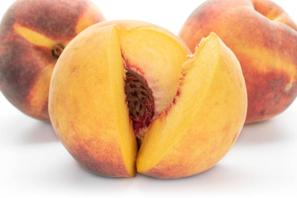 istock Fresh fuzzy peach isolated on white 1176899436