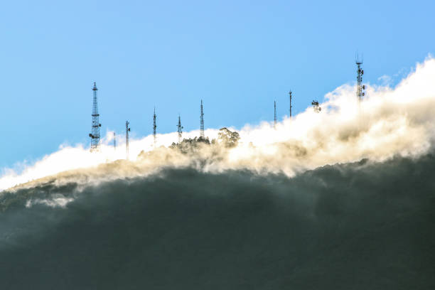 istock Communication antennas behind the fog on the mountain 1176899508