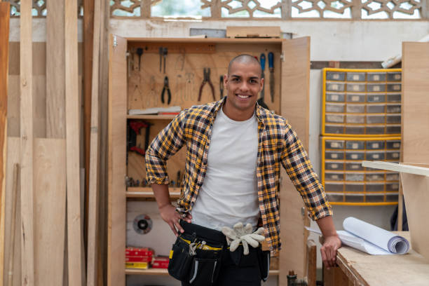 istock Happy Latin American carpenter smiling 1176899938