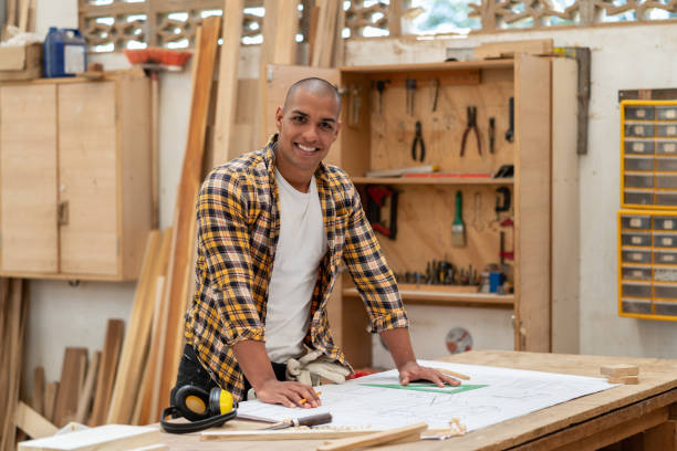 istock Happy man working at a carpentry 1176899948