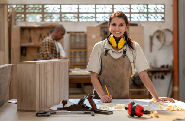 istock Female carpenter making furniture at a workshop 1176899986