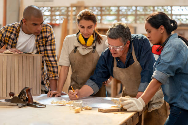 istock Team of workers making furniture at a carpentry 1176900005