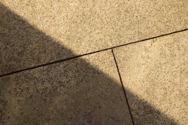 istock Paving slabs in shade from sun. Cityscape close-up view 1176900872