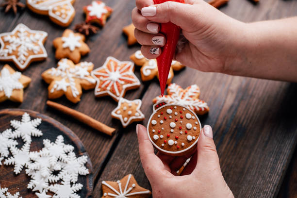 istock Friends decorating christmas gingerbread cookies 1176901795
