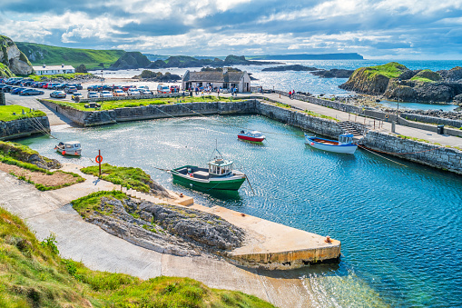 Stock photograph of the picturesque Ballintoy Harbour, Causeway Coast, Northern Ireland, UK on a sunny day.
