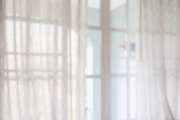 istock window curtain with green garden abstract blur background 1176906194