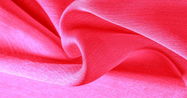 istock Background pattern texture wallpaper, crimson pink silk fabric. It has a smooth matte finish. Use this luxurious fabric for anything - from design to your projects The possibilities are truly endless! 1176907197