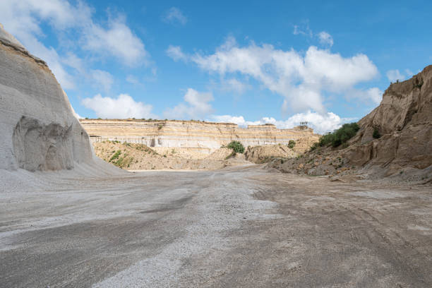 istock Sand quarry landscape with vivid blue sky and clouds 1176916792