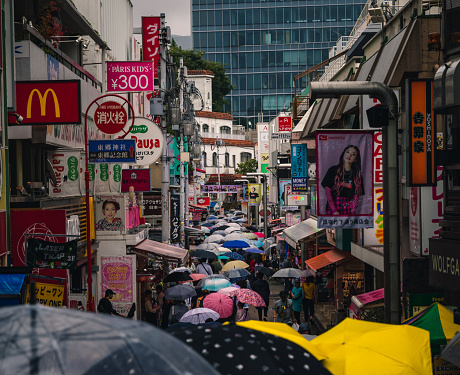 Harajuku Tokyo Japan colorful street with umbrellas and rain