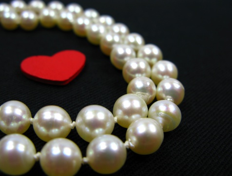 White pearls with red heart