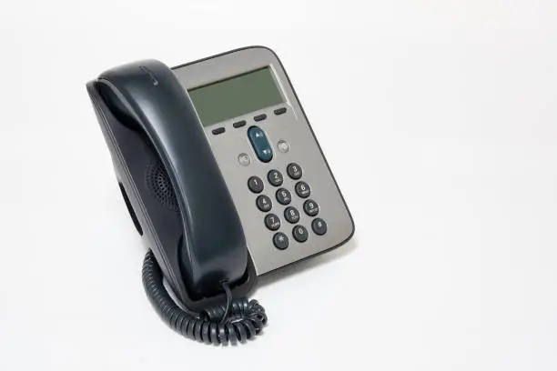 Photo of Office IP telephone with LCD. VOIP Telephony multi function. isolated on white background