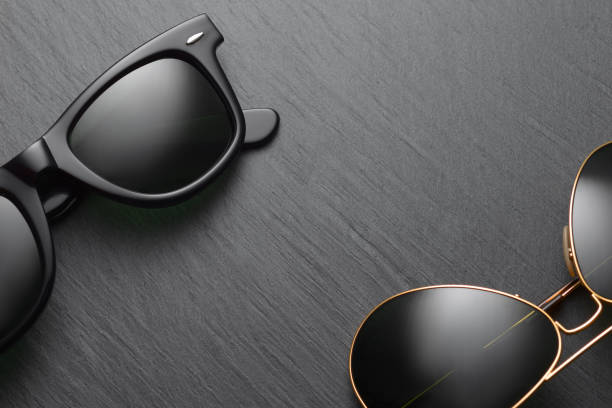 istock Classic sunglasses on black slate background 1176927434