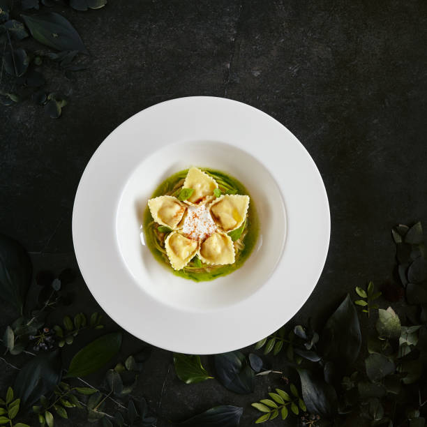 tortellini with shrimps or seafood ravioli, young zucchini ragout top view - hot couture imagens e fotografias de stock