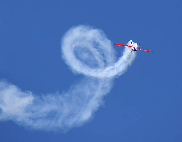 aerobatic stunt Extra 300 airplane Aerobatic stunt in Extra 300 stunt plane. airshow photos stock pictures, royalty-free photos & images