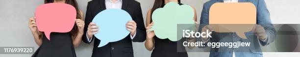 People Are Holding Colorful Speech Bubbles Stock Photo - Download Image Now - Questionnaire, Speech Bubble, Discussion