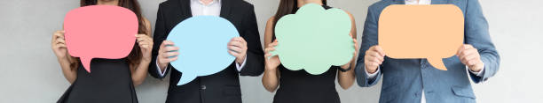 people are holding colorful speech bubbles. - announcement message fotos imagens e fotografias de stock