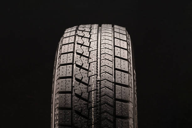 istock winter tires without studs Velcro closeup on black background 1176939273