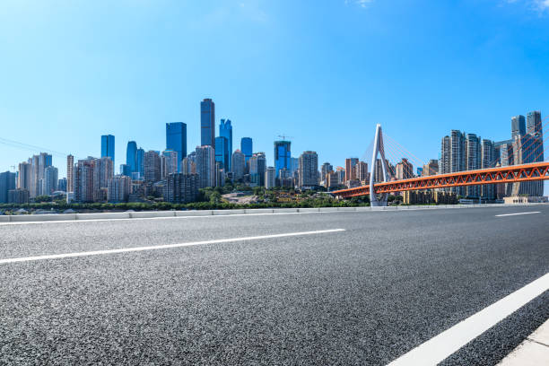 istock Empty asphalt road and Chongqing architectural landscape with bridge 1176939560