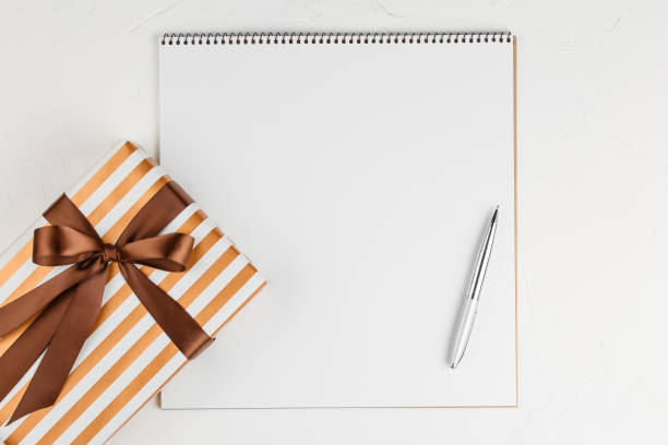istock Congratulatory letter with presents on the table. 1176941374