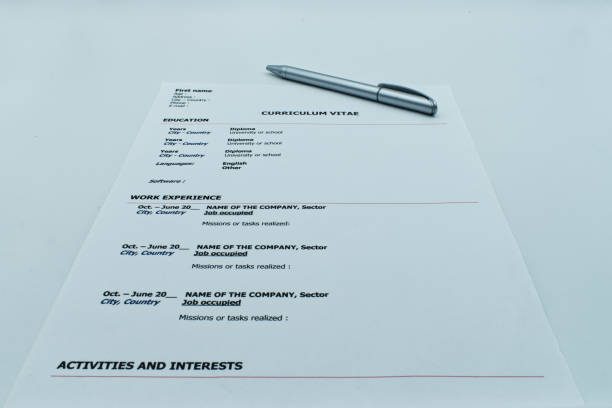 istock Resume, Curriculum Vitae, ready to be filled out with a pen, on white background 1176942869