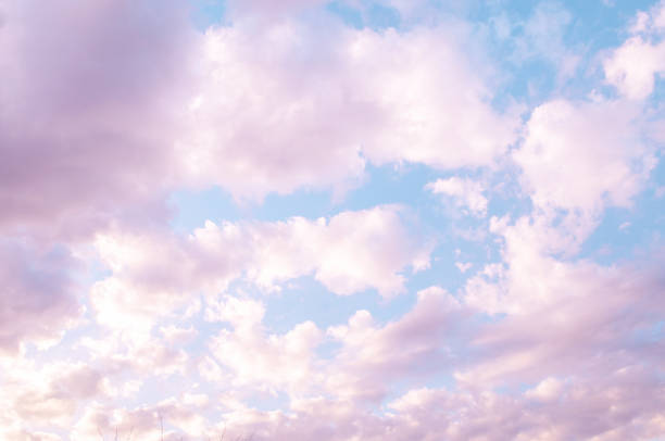 Pinky blue evening sunset sky, vanilla sky scattered clouds background - Nature weather image
