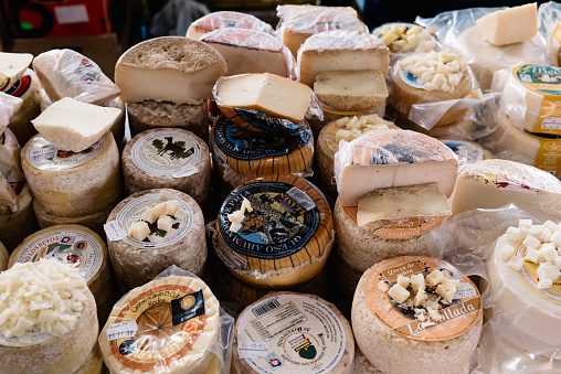 Cangas de Onis, Spain - March 31, 2019: Assortment of traditional asturian cheeses ready to taste in food market.