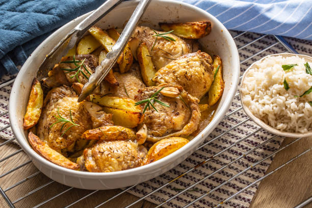 istock Chicken legs roasted with american potatoes in baking dish 1176947187