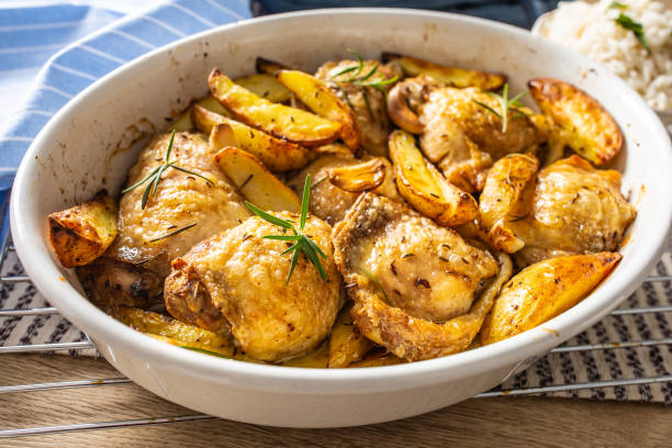 istock Chicken legs roasted with american potatoes in baking dish 1176947209