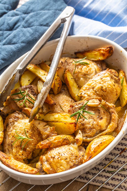 istock Chicken legs roasted with american potatoes in baking dish 1176947219