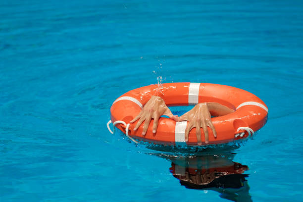 istock Red lifebuoy in the pool 1176947230