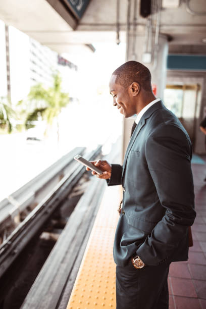 istock man waiting the train at the station 1176951088
