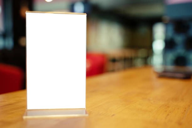 istock Mock up Menu frame standing on wood table in Bar restaurant cafe. space for text 1176955453
