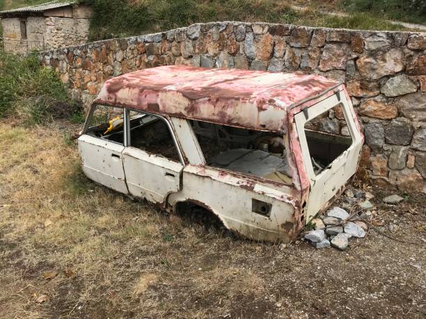 Vintage car wreck Ohrid, Macedonia, - September 21, 2019. Vintage car wreck in the country side. 1960 1969 photos stock pictures, royalty-free photos & images