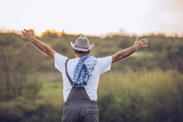 istock Satisfied older farmer in the field 1176955753