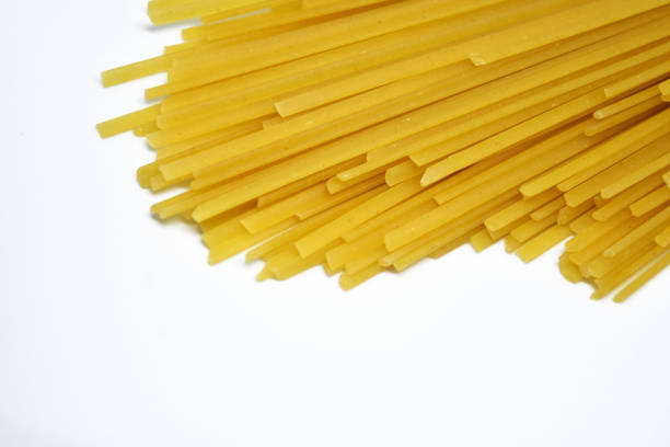 istock Raw Italian spaghetti pasta on white background. 1176956249